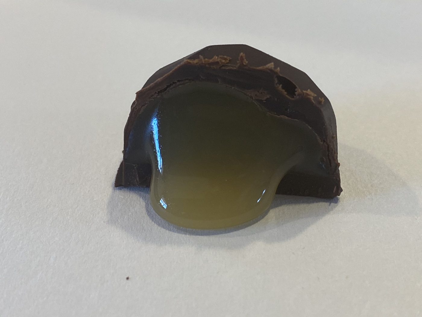 A Buzz Bite cut open, honey caramel spilling out